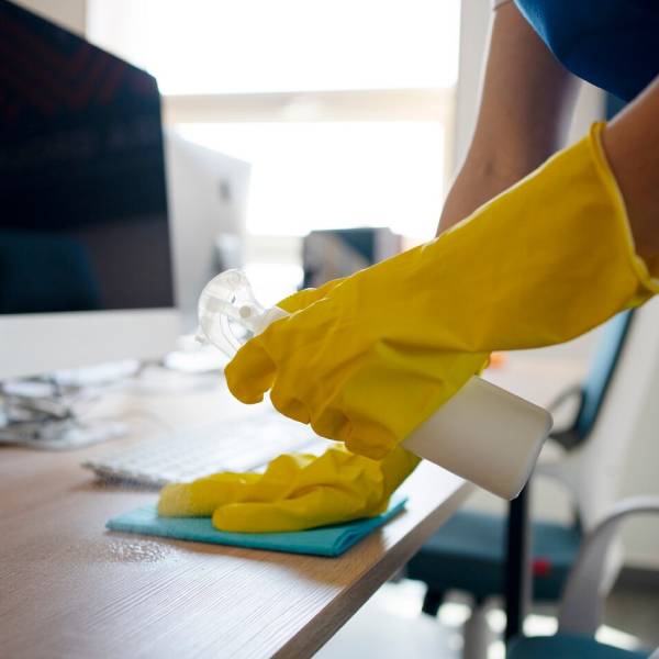 Expert office commercial cleaning Burnie team sanitizing desks and work areas